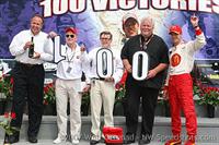 Paul Newman, Carl & Mike Lanigan with Sebastien Bourdais on the podium at Portland